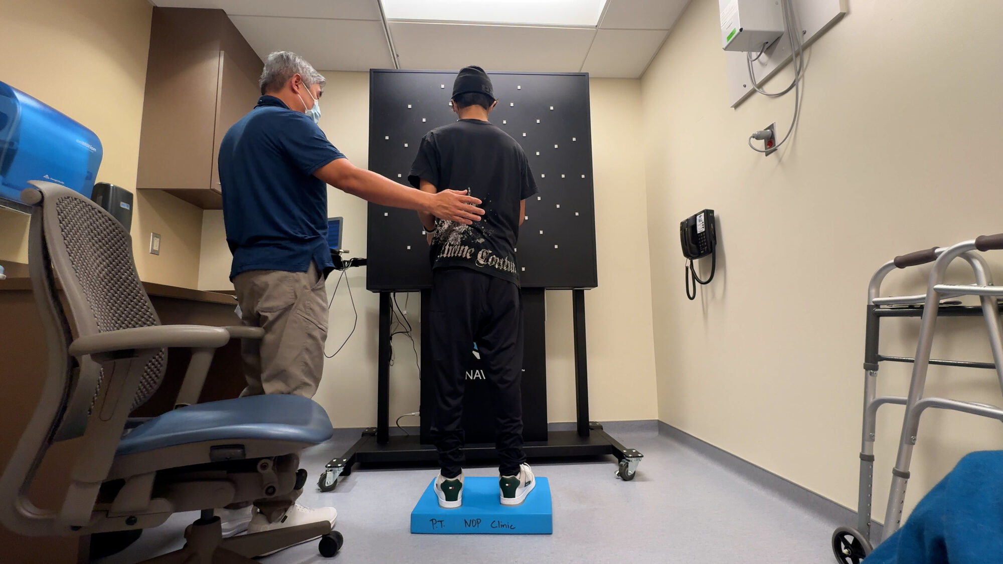 Charlie relearning to stand in the rehabilitation room